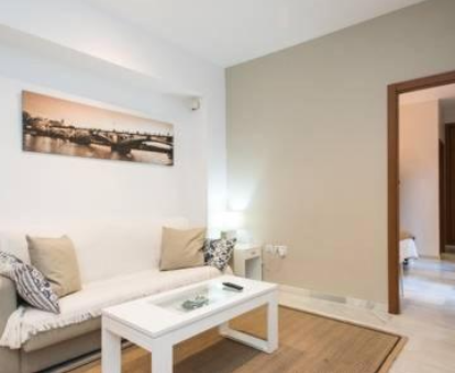 Zona de estar del apartamento con spa 2 Calle Villegas en Sevilla