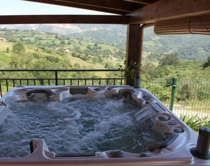 Foto del Apartamento Superior con sauna y jacuzzi privado con vistas a la naturaleza.